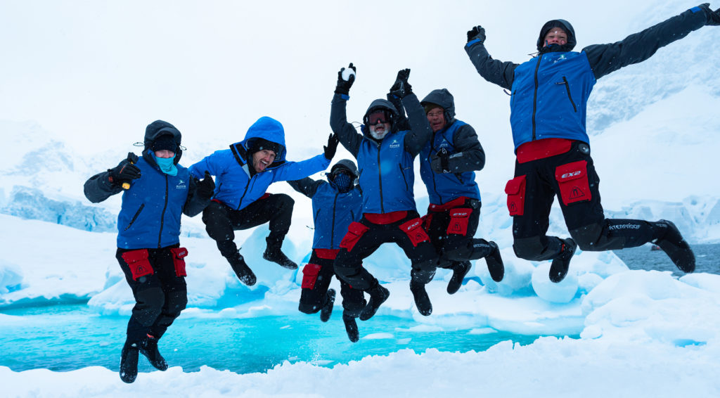Happy passengers celebrating in Antarctica